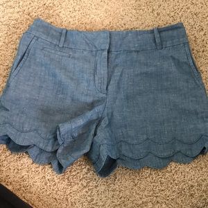 Denim shorts with scalloped bottom